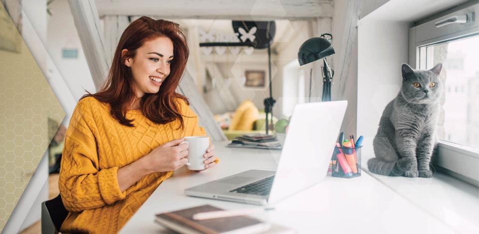 Working professional supporting her mental wellbeing by taking a break from working from home to drink coffee with her cat.