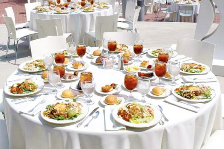 Empty round table with plated food displayed