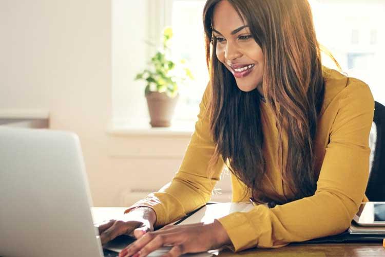 Working professional learning on laptop computer