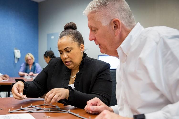 Management learners collaborating in classroom