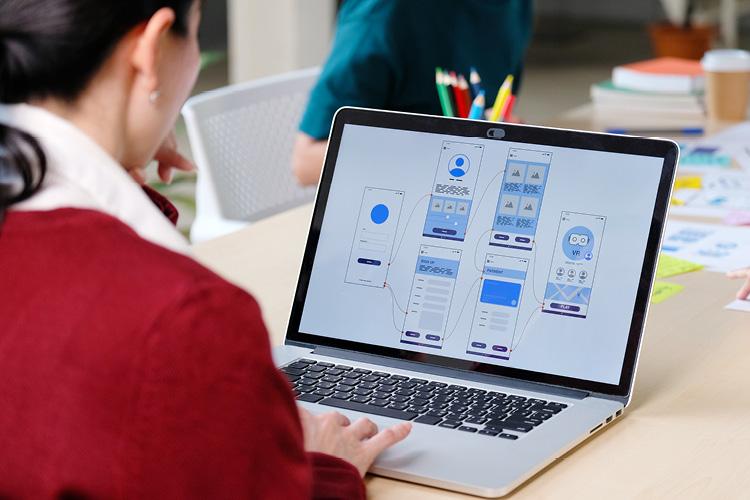 Product Manager working on laptop computer