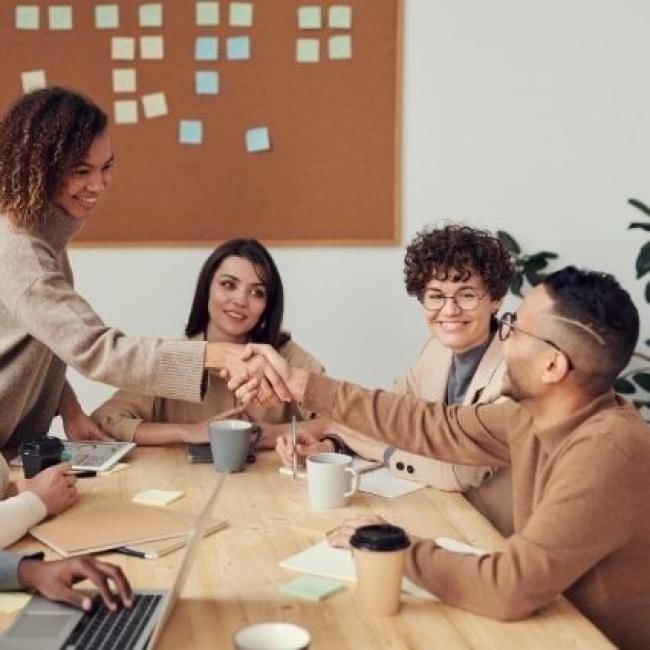 Coworkers collaborating together in office