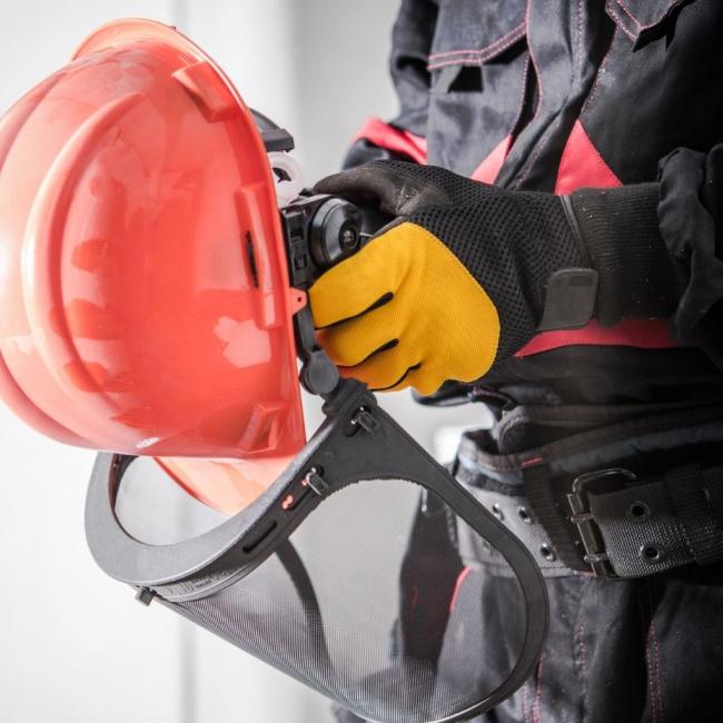 OSHA professional wearing personal protective equipment at work.