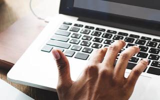 Working professional using computer to submit contact form